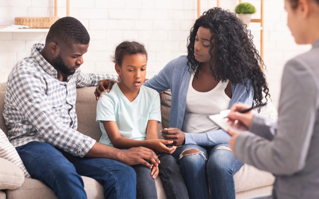 child joins parents during family counseling for addiction in Knoxville, TN