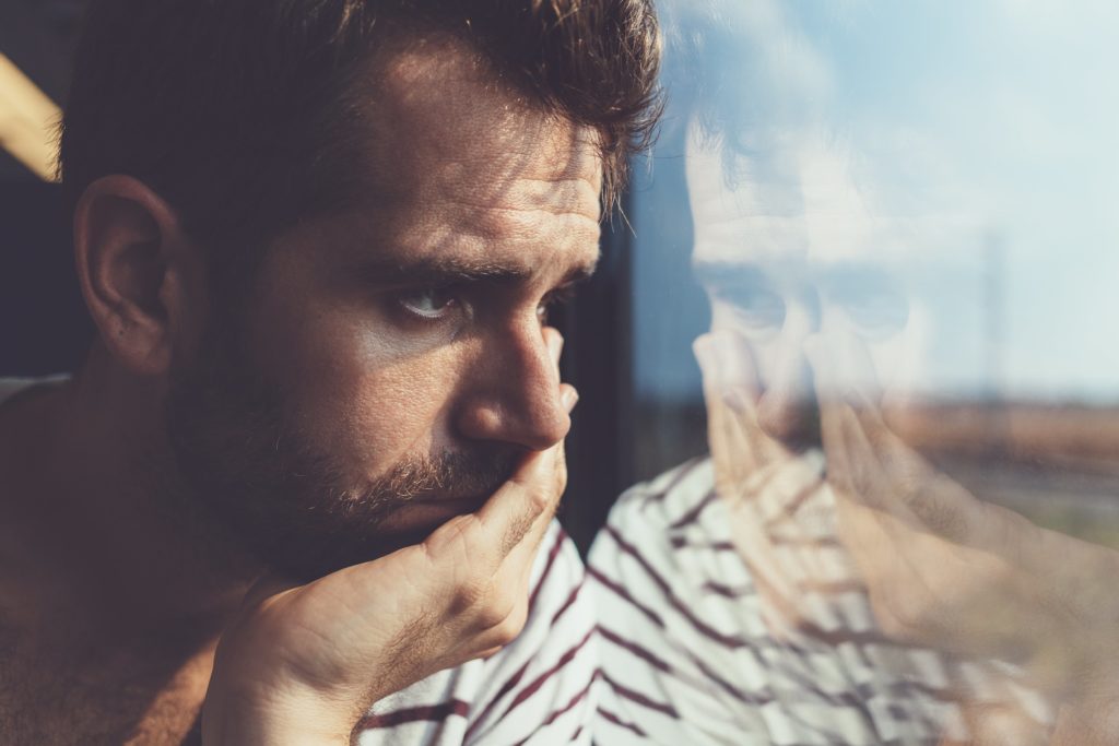 man wondering if substance abuse is affecting his life