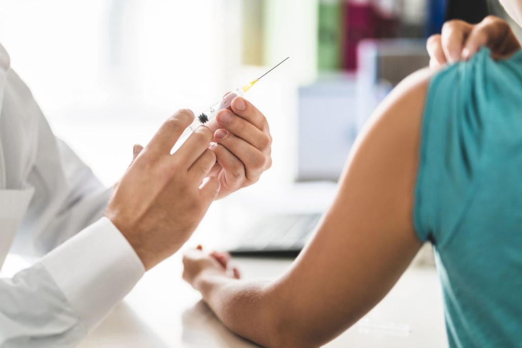 doctor prepares client for buprenorphine injection