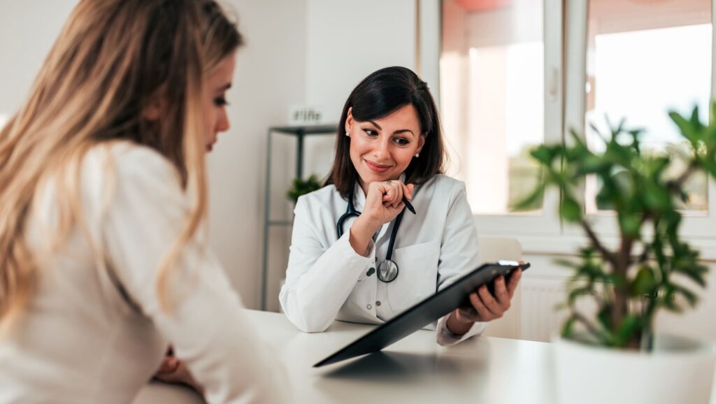 An insurance specialist helps a client with her United Healthcare rehab coverage in Knoxville, TN.