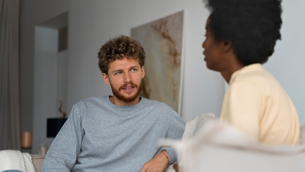 A man discusses options for MAT services while attending an alcohol dependency recovery program.