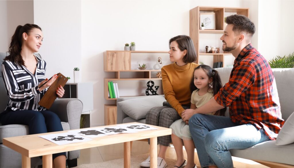 Parents enjoy a treatment session with their daughter during family rehab